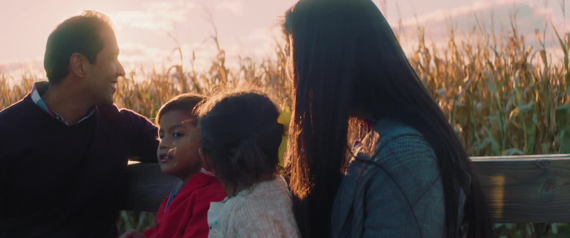 A family goes on a hay ride at sunset