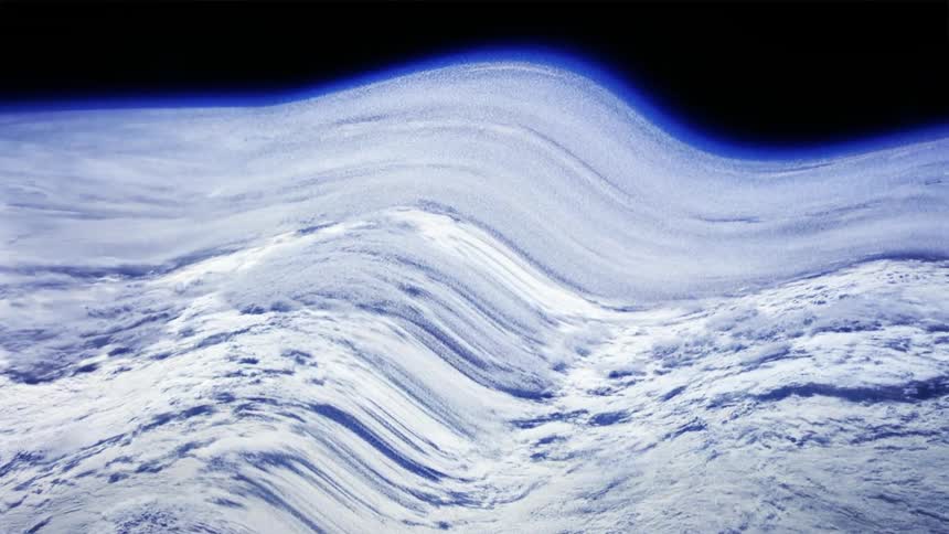 The cloudy atmosphere of earth can be seen from outer space but the image appears warped by a large wave of distortion