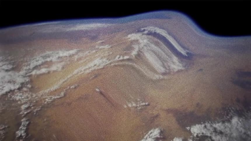 The planet earth can be seen from outer space but the view of it is severely warped and distorted