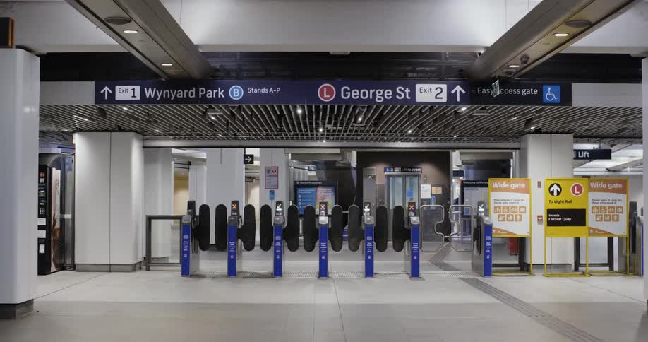 The turnstiles are empty in the train station