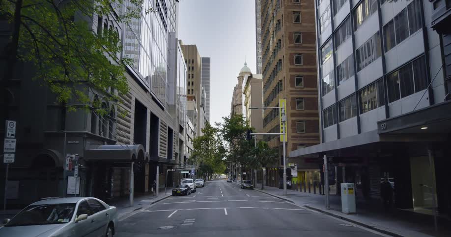 The city street is empty during the day