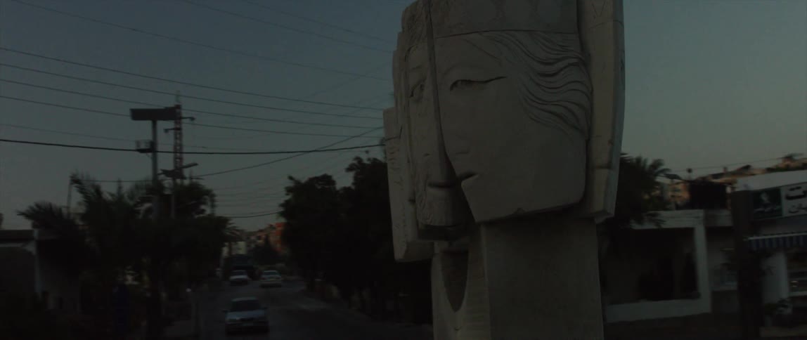 A large outdoor sculpture at dusk