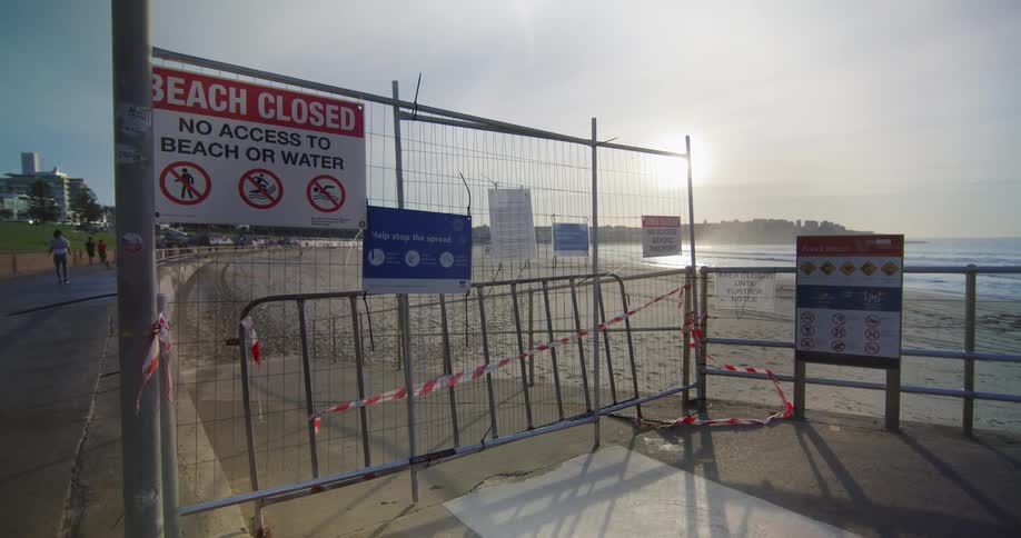 A closed gate barring access to a beach