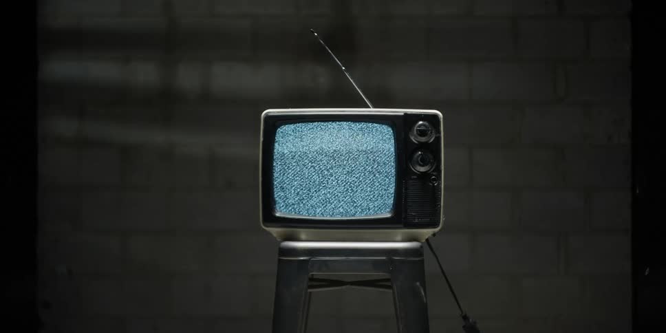 Static flashes on an old television set with an antenna