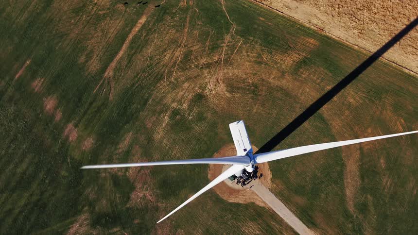 The blades of a wind turbine turning