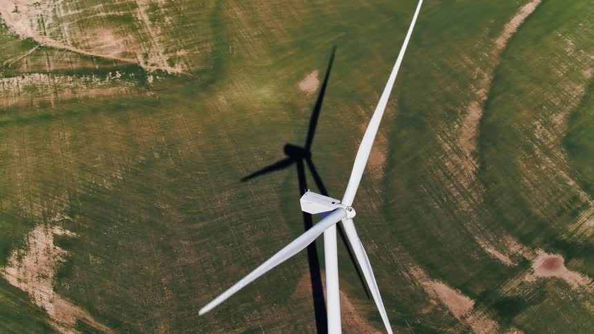 A wind turbine on a large flat field