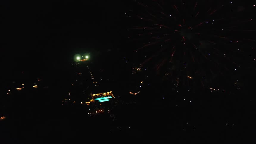 Fireworks exploding over the water