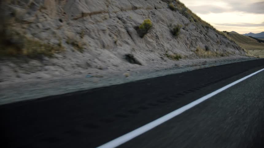 A cliff beside a road