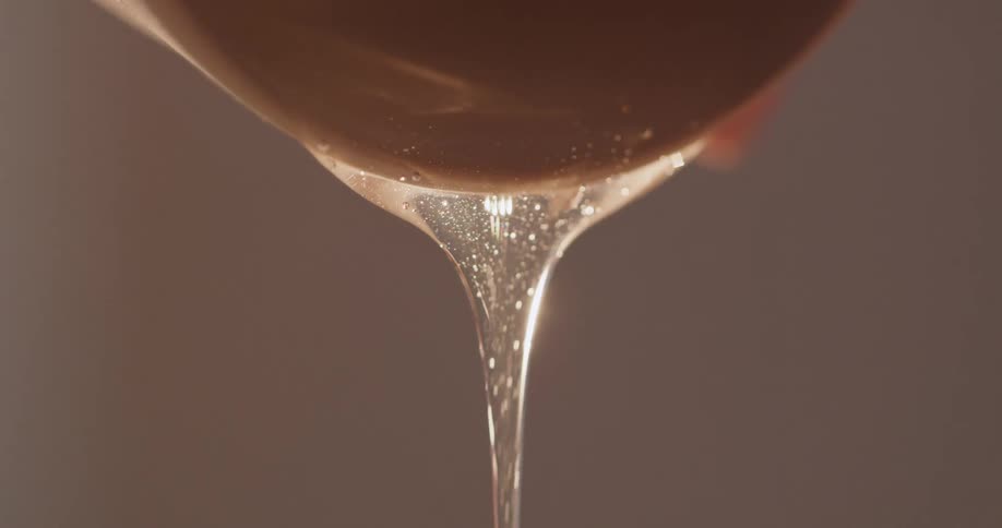 A dripping clear liquid with air bubbles