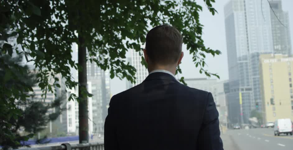 A man walks down a city street