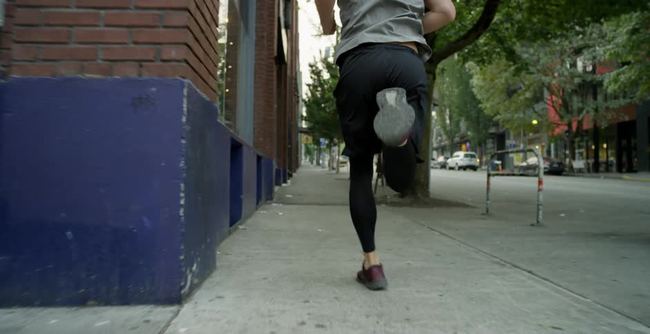 A man running down a city street
