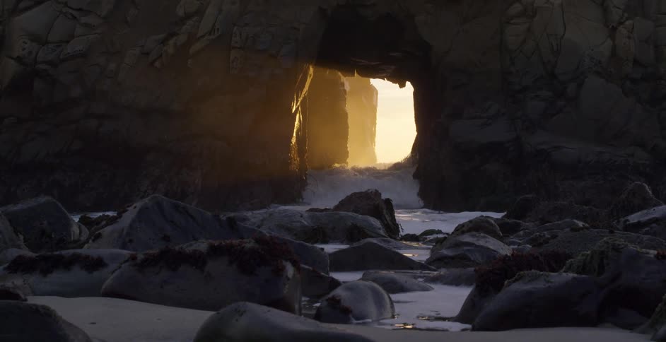 Waves crashing between rocks as they head towards the shore
