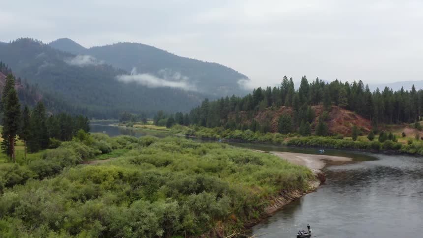 People canoeing down a river