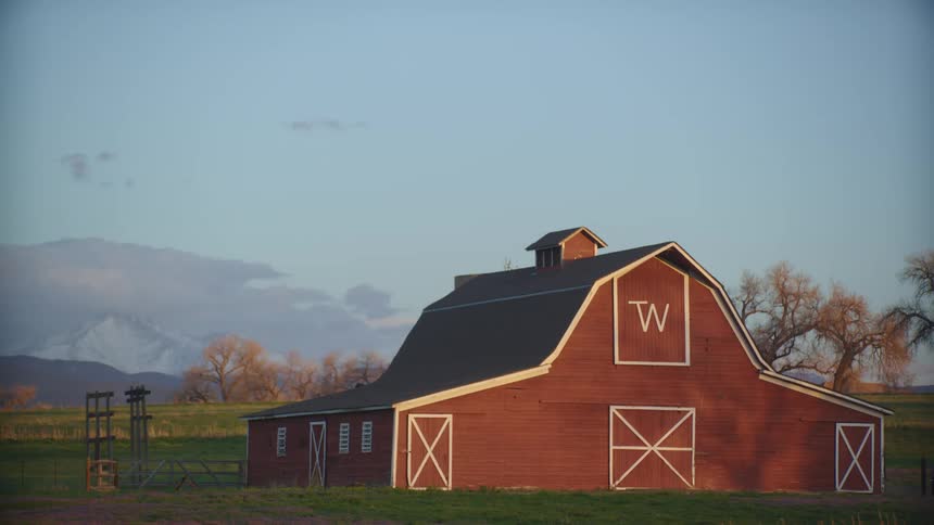 A barn at a rural area is displayed