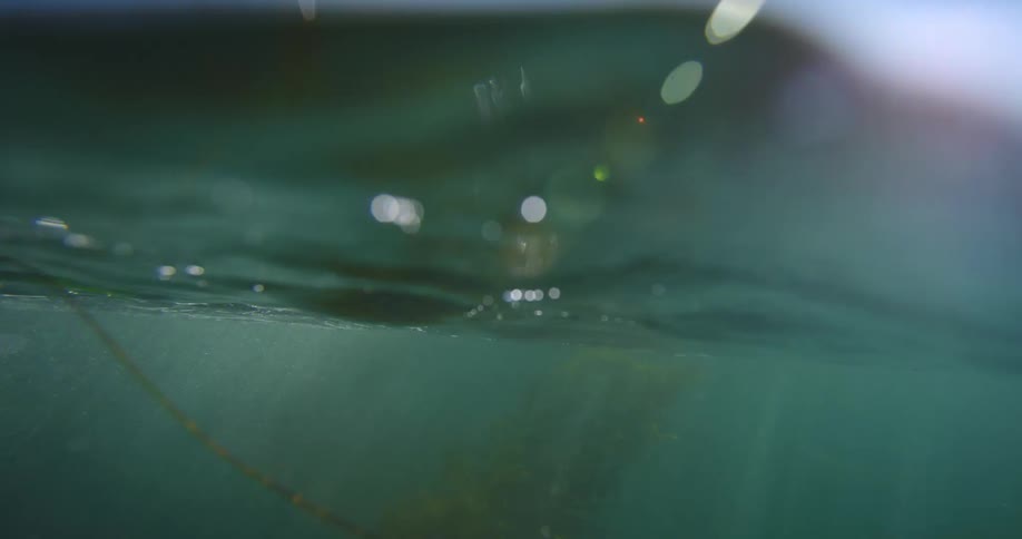 Footage of the waves on top and from under the water