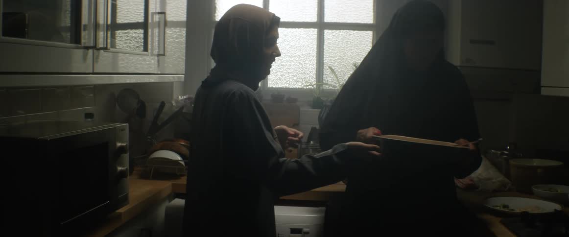 Two women cooking in a kitchen