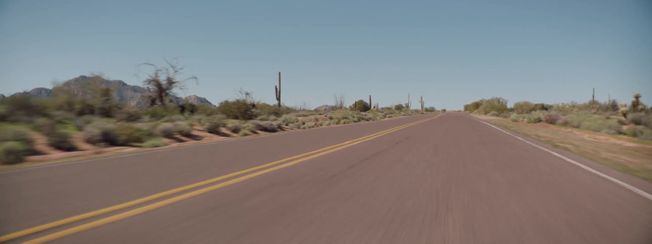 Driving on the highway through the desert