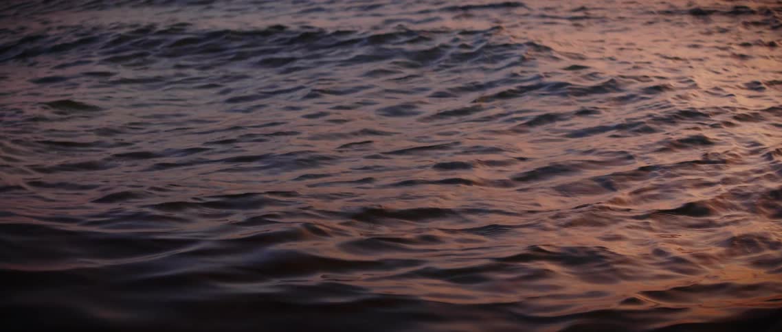The sun reflects off the water