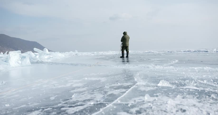 A man ice fishing