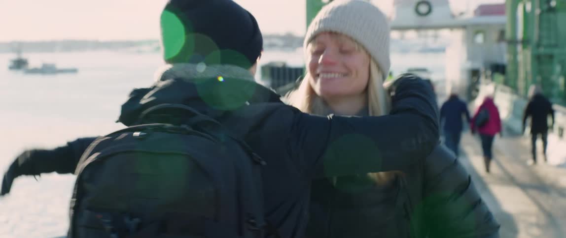 Friends greet each other at the docks during winter