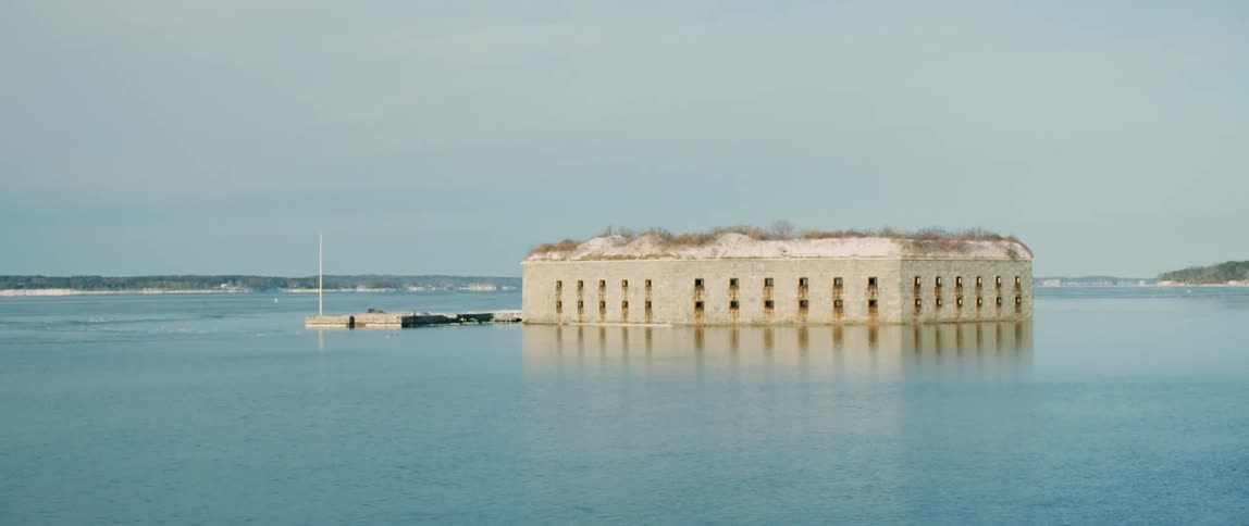 Passing by an abandoned military fort in the Portland Harbor during winter