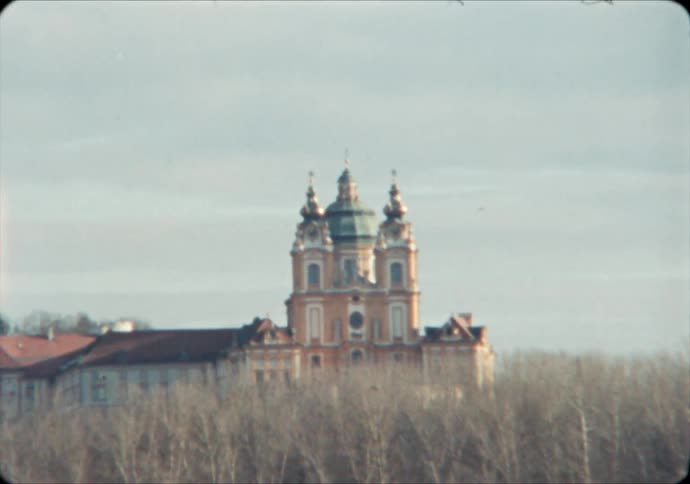 Melk Abbey stands above bare winter trees