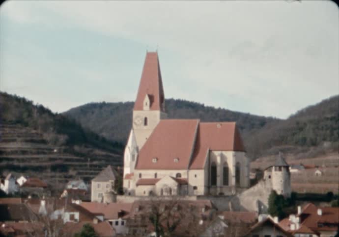 A parish church sits nestled in hills of Marktgemeinde Austria