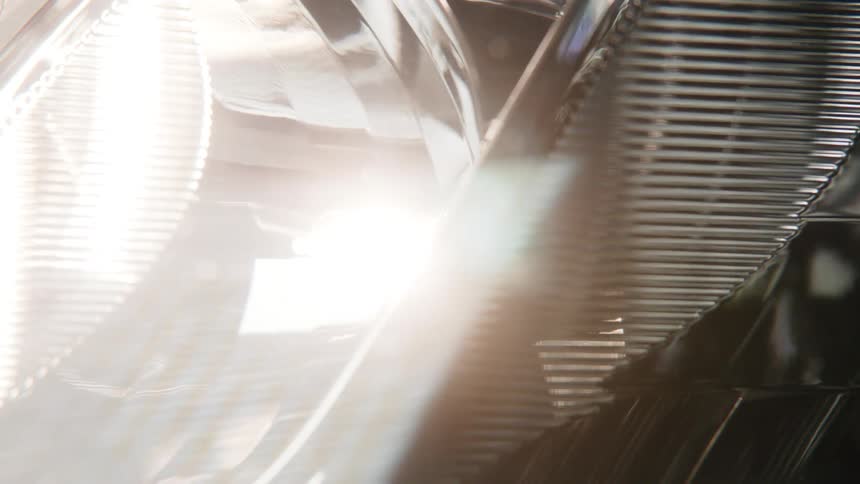A vehicle headlight with a light bulb with lights and reflection