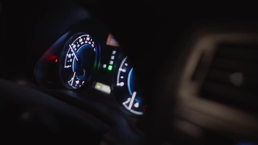 A car is being driven at night