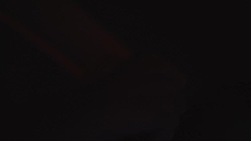 A person drives at night
