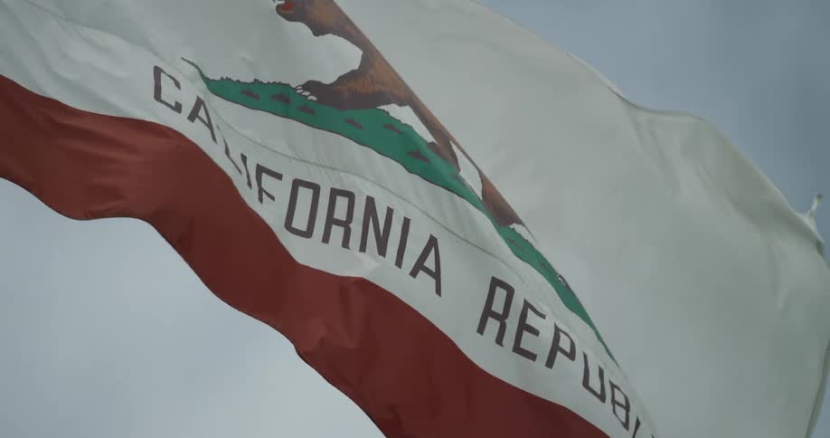 The california flag billows in the wind