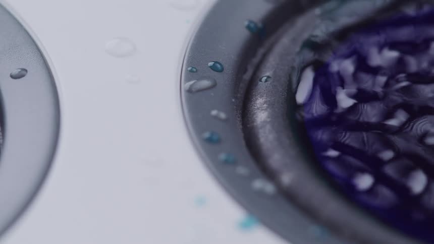 Liquid colored with purple dye spins in a centrifuge and starts to become a gel