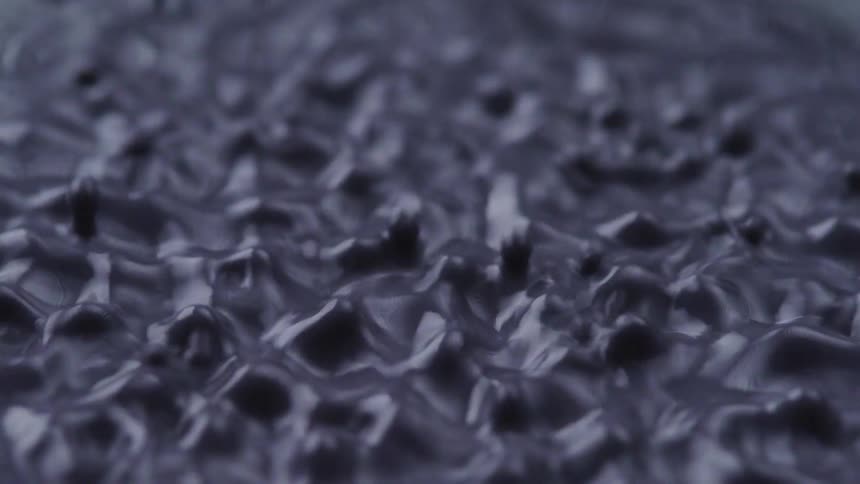 The liquid vibrates and bubbles