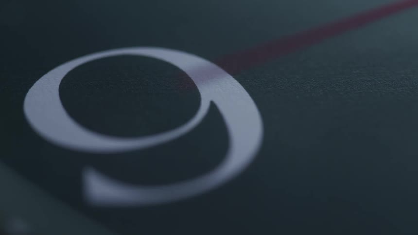 A large number 9 with a red line reflecting across it