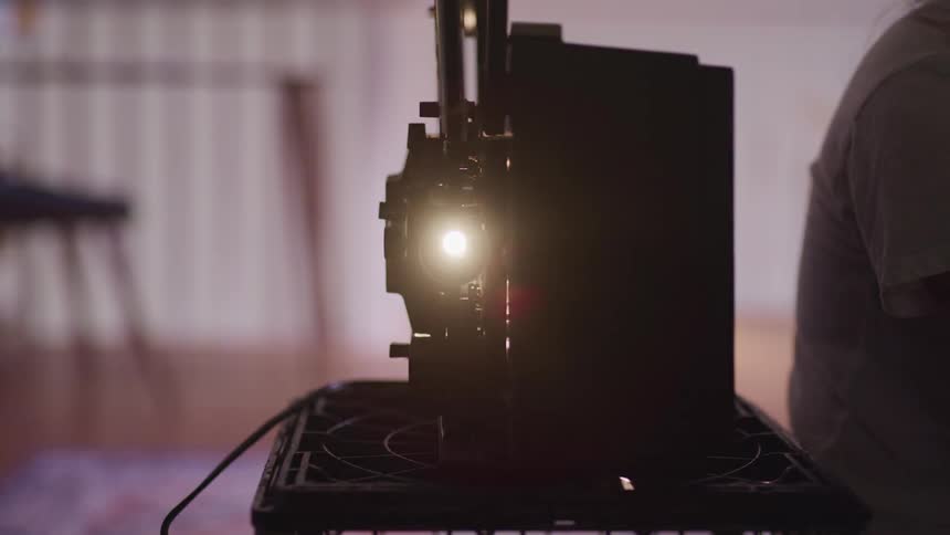 White light flashes on the front of a projector