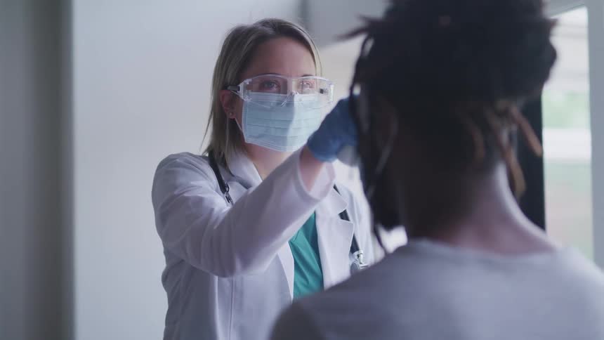 A doctor is examining a patient at a clinic