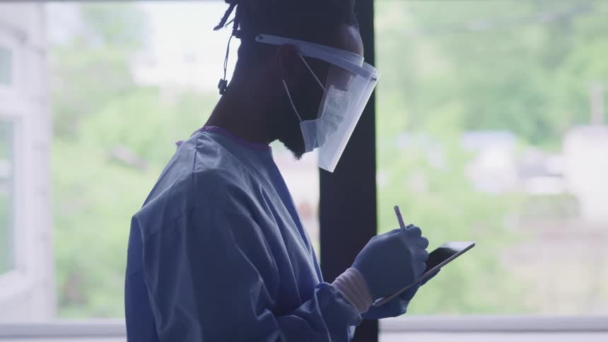 A doctor uses a tablet