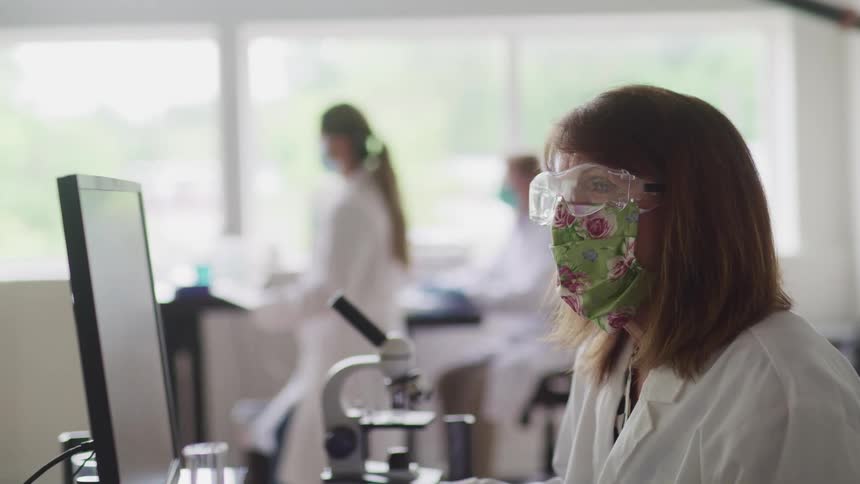 Doctors are in a lab using equipment