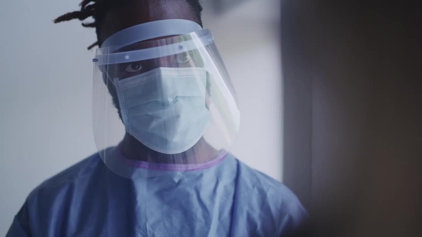 A doctor is wearing a mask indoors