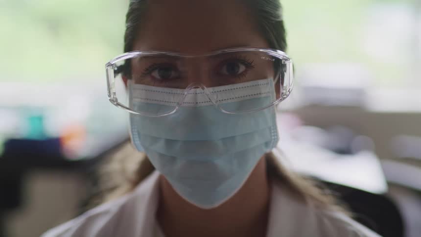 A scientist looks up in the lab