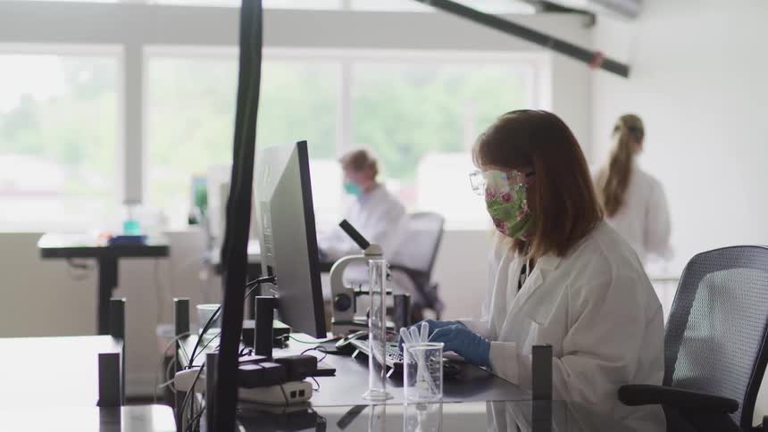 Doctors are in a lab using equipment