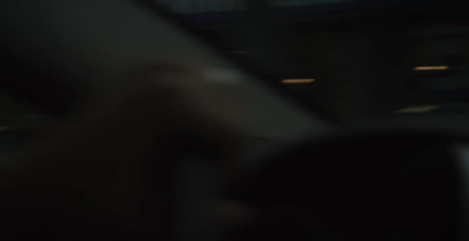 A vehicle drives by a furniture store