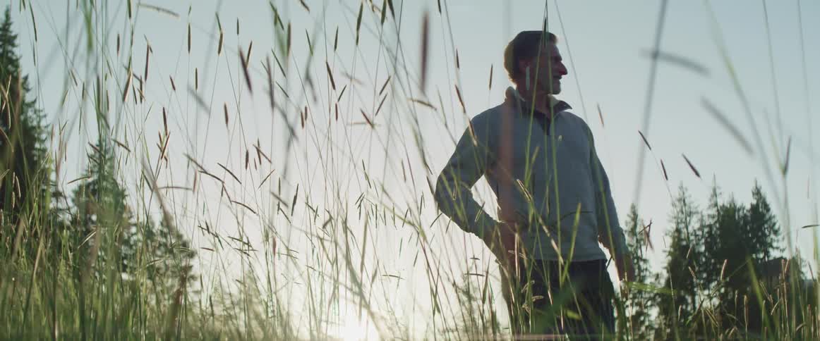 A man looks around the forest