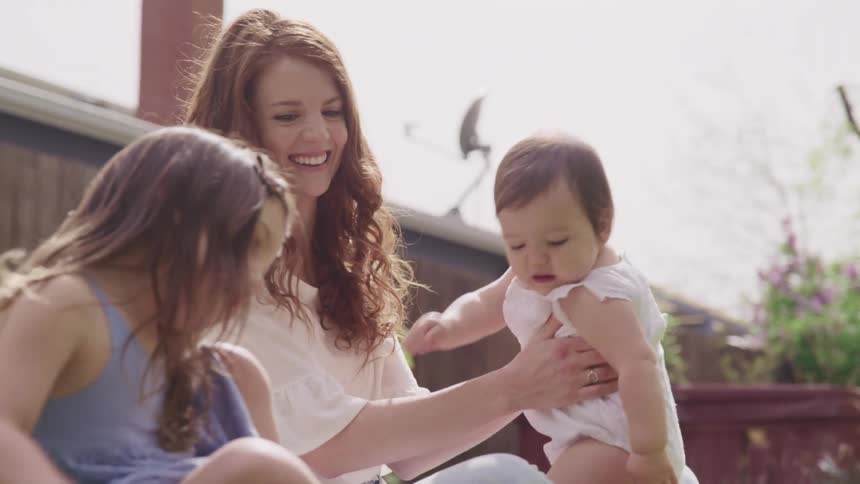 A family play in the yard