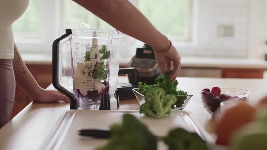 A woman is preparing food in her kitchen