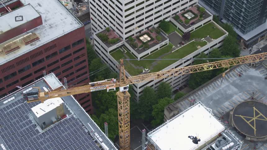 An aerial view of a downtown city is displayed