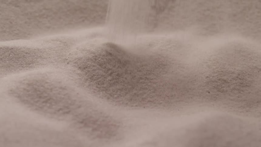 Sand is being poured down