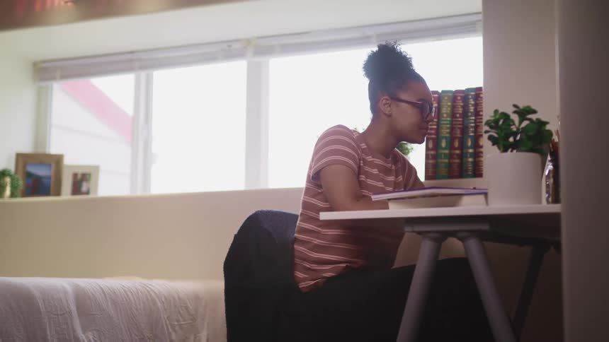 A girl is doing school work at home