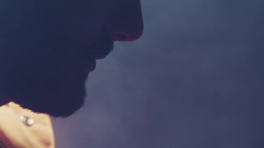 Smoke surrounds a mans face