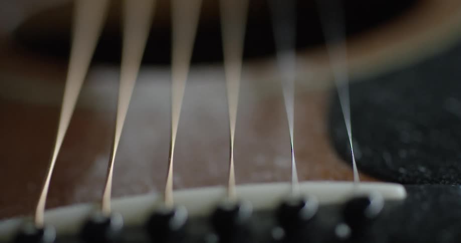 Guitar strings vibrate and shake